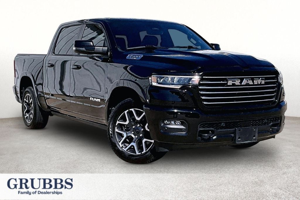 2025 RAM 1500 Laramie in Diamond Black Crystal Pearlcoat — front three-quarter view