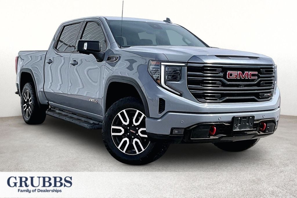 2024 GMC Sierra 1500 AT4 in Thunderstorm Gray — front three-quarter view